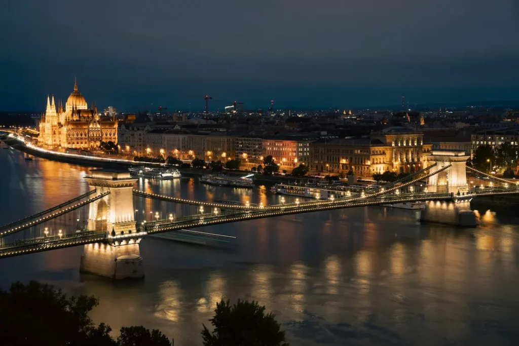 Budapest Parliament and Chain Bridge at night over the Danube River Hungary