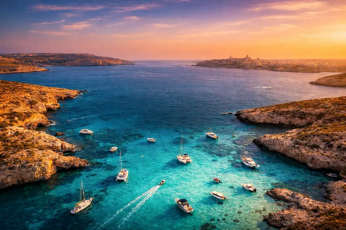 best eSIM for Malta 2026 Blue Lagoon Comino turquoise water boats aerial view
