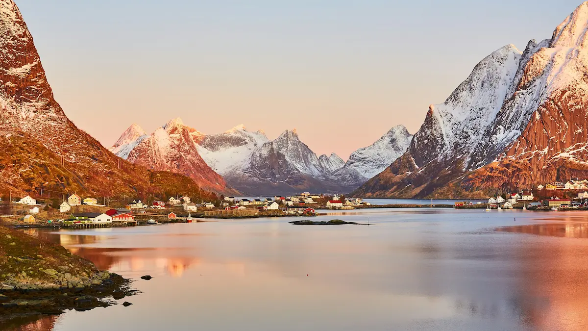 Lofoten Norway fjord village at sunrise with mountains reflection Scandinavia travel