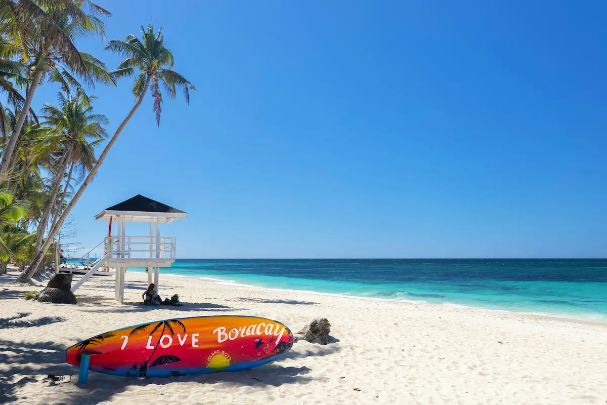 best esim for philippines 2026 boracay white beach tropical island travel scene with palm trees and crystal clear water
