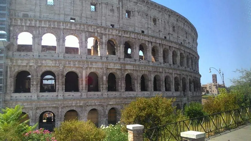 colosseum rome real view daylight tourists outside best esim for italy 2026 travel scene