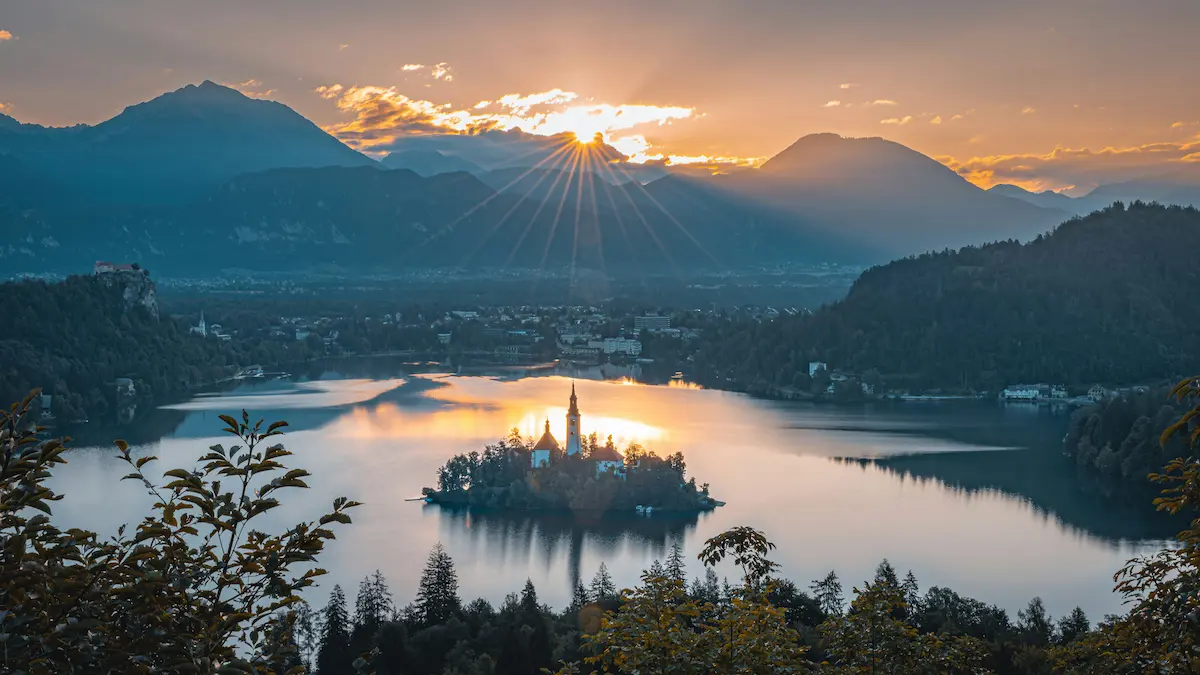 Lake Bled Slovenia sunrise with island church and Julian Alps mountains best eSIM Slovenia 2026
