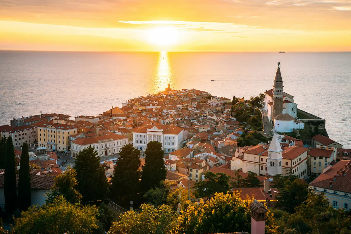 Piran Slovenia sunset Adriatic coast old town red roofs sea view 2026