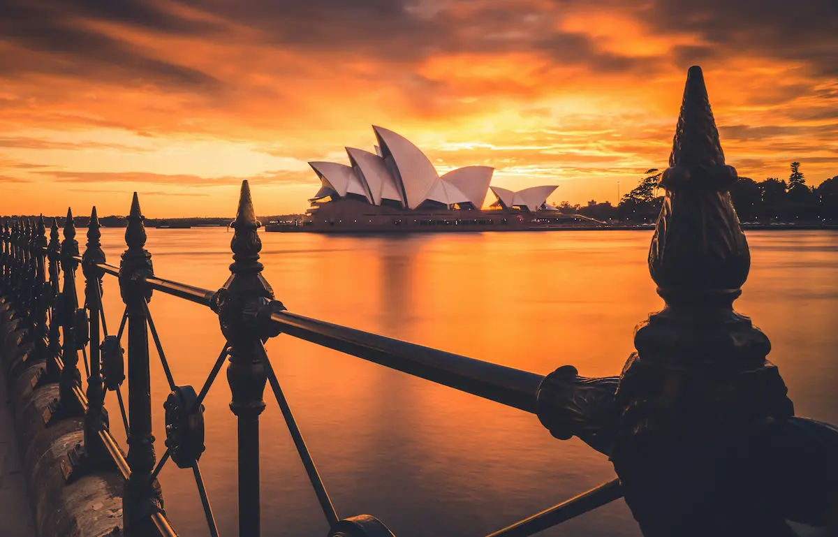 Sydney Opera House at sunset in Australia with harbor reflection — best eSIM for Australia 2026 travel guide