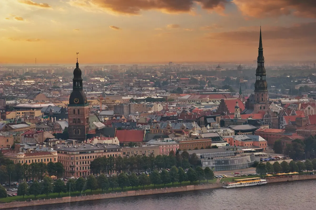 Best eSIM for Latvia 2026 view over Riga Old Town at sunset showing real travel destination coverage beyond the capital
