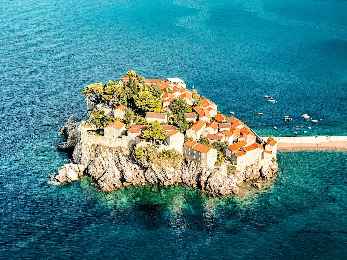 Sveti Stefan Montenegro aerial view with turquoise water Adriatic coast luxury island resort best esim coverage 2026