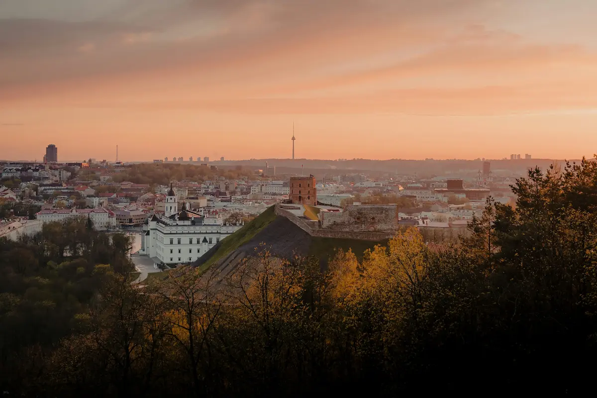 Vilnius Old Town skyline with Gediminas Tower at sunset Lithuania