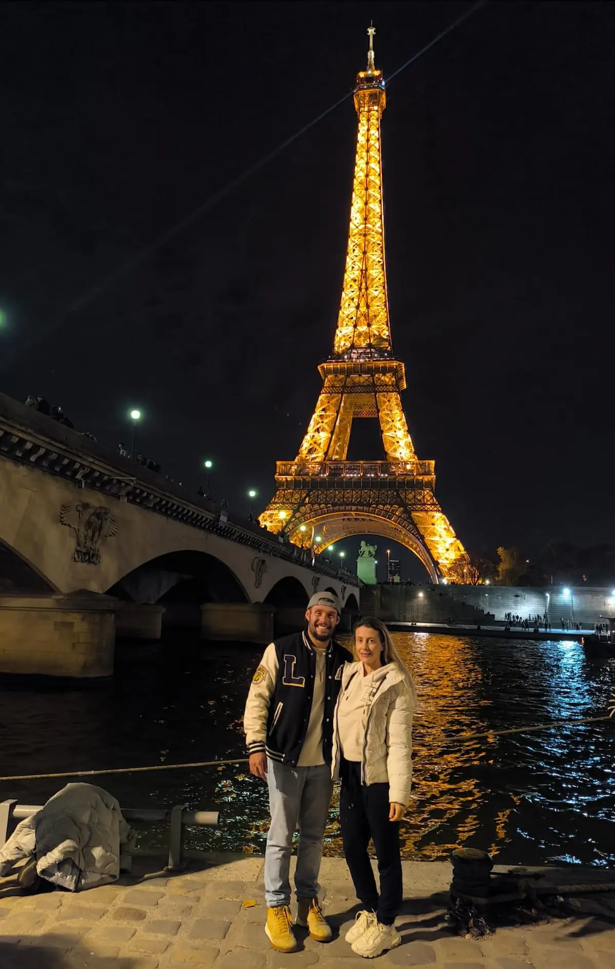 Andre and Nicoli at the Eiffel Tower in Paris France during their Europe journey after leaving Brazil