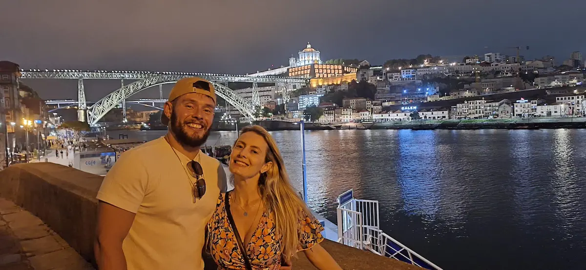 Andre and Nicoli in Porto Portugal by the Douro River during their life and travel journey across Europe