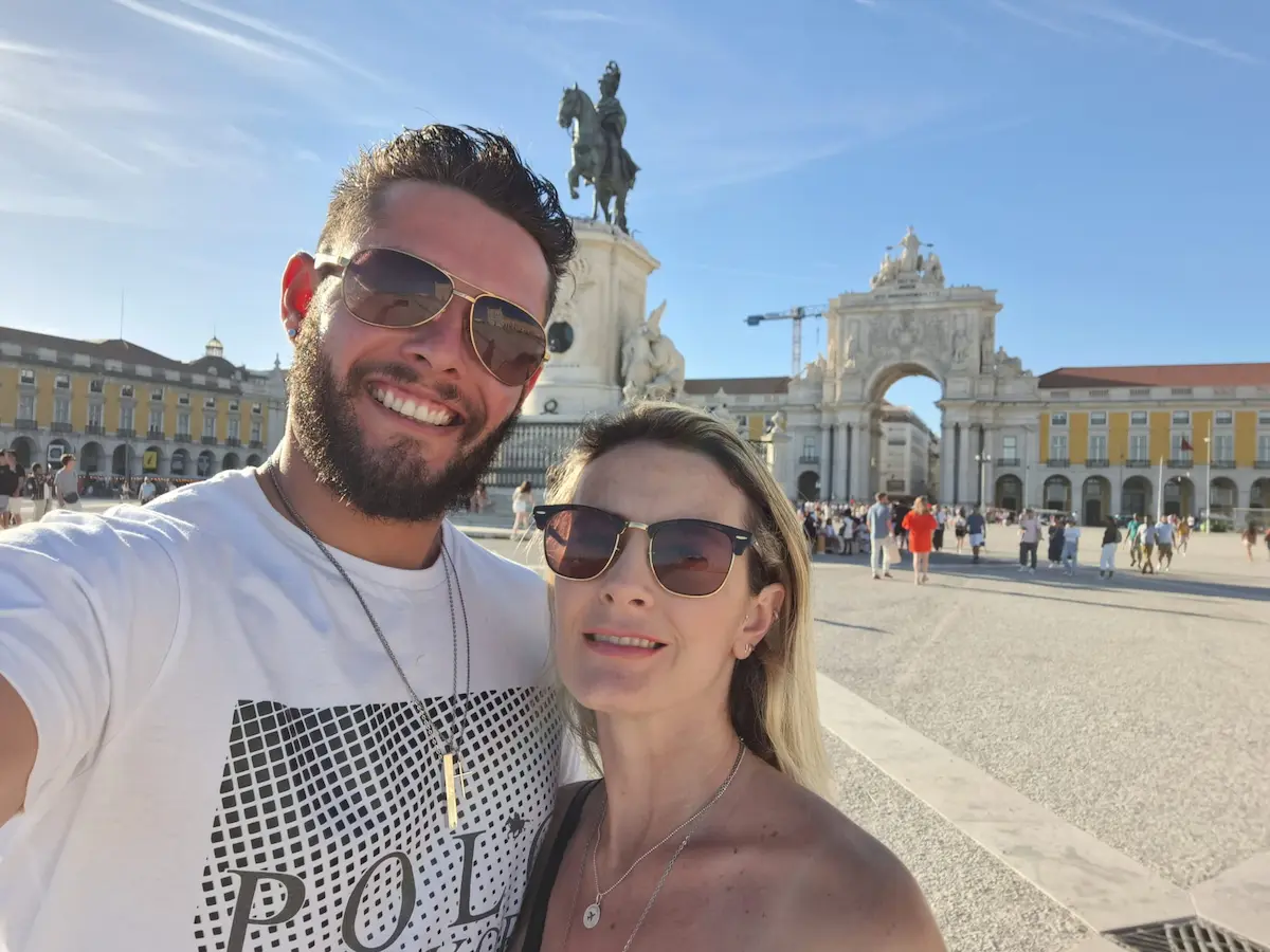 andre and nicoli at praça do comércio lisbon portugal after moving from brazil to europe